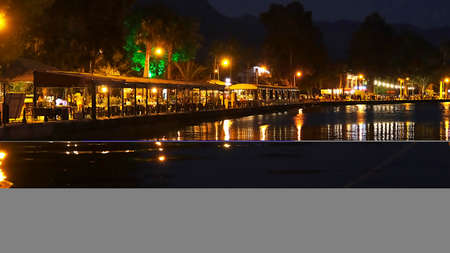 Night view of the river and the restaurant in the city of Batumi, Georgiaの写真素材