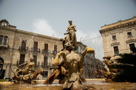 Classic fountain with statue of Diana in Ortigia, Sicilyの写真素材