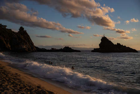The beach of Palmi dell'Ulivarella in Calabria, Italy. Summertime. Holidays. Sunset.