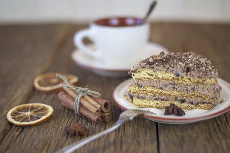 cake with walnuts, prunes and dried apricots on a dark wood background, selective focusの写真素材