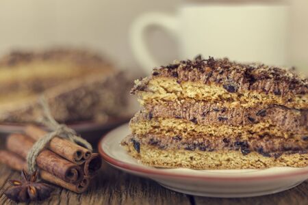 cake with walnuts, prunes and dried apricots on a dark wood background, selective focusの写真素材