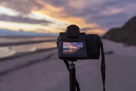 Colorful the sea sunset with  orange-violet paints