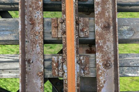 Old railway and railway bridge, rails and pilesの写真素材