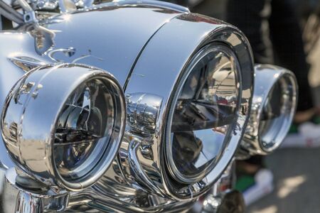 Chromed headlamp of a  motorcycle, stylish classic chrome-plated motorcycle headlight,close-up,の写真素材