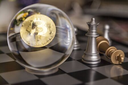 bitcoin of the black background,  on Golden nugget gold background. Finance conceptの写真素材