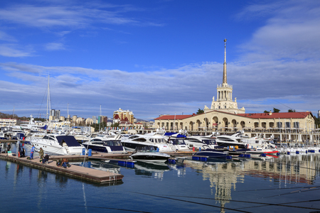 SOCHI,  RUSSIA- 25  december 2017:Marine Station of Sochi, a small sailing boats in Havana Sochi sea port on a background marine station/view of the Harbor Sochi sea port and the marine station buildingのeditorial素材