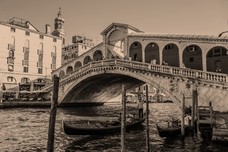 Venice.Italy. 23 August -2016:Tourists in gondolas sailing on the grand canal, toned- sepiaのeditorial素材