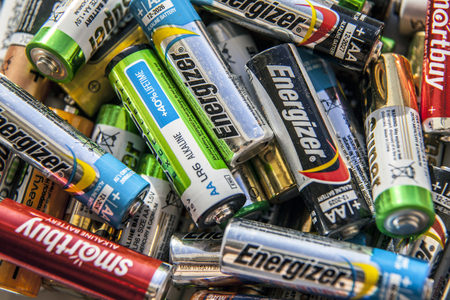 Rostov on Don, RUSSIA - 26 SEPTEMBER, 2018: Batteries background, Used batteries from different manufacturers, waste, collection and recycling, editorial.のeditorial素材