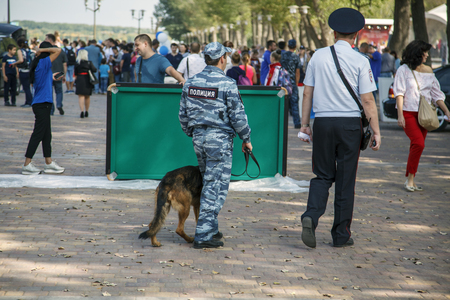 Rostov-on-Don, Russia-September 25, 2018: embankment of Don river; celebration of the city day, Policeman with a dog protect from terrorists, editorialのeditorial素材