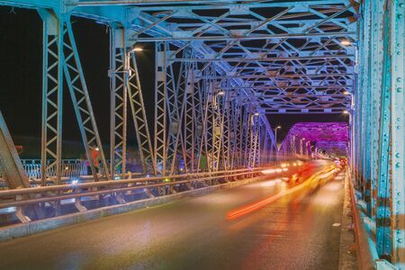 Colorful close up Trang Tien bridge night view from above in Hue City, Vietnam , light lines from...