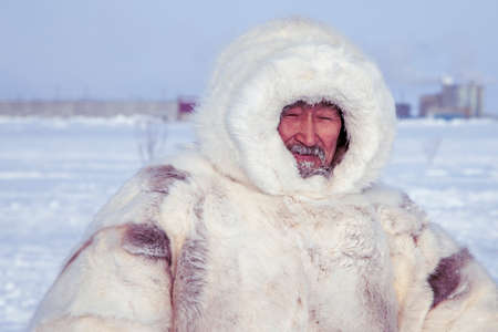 Tundra, Yamal Peninsula, far north, reindeer pasture, dwelling of northern peoples, portrait of a shaman in a white fur coatのeditorial素材