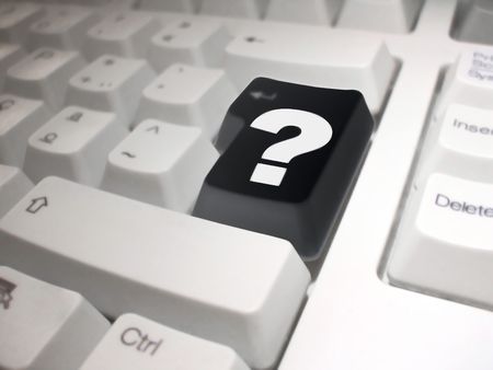 question mark on black enter key on a white background.の写真素材