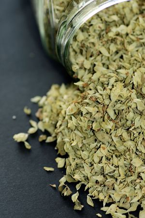 Pile of oregano spice herb spilled over the table.の写真素材