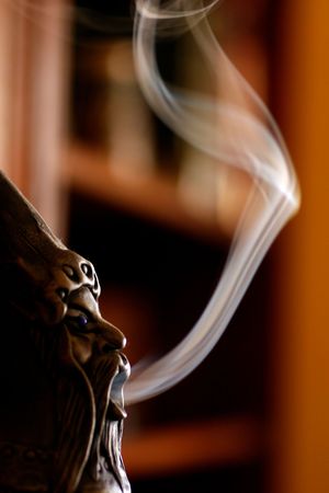 Close up view of a smoking doll with smoke.の写真素材
