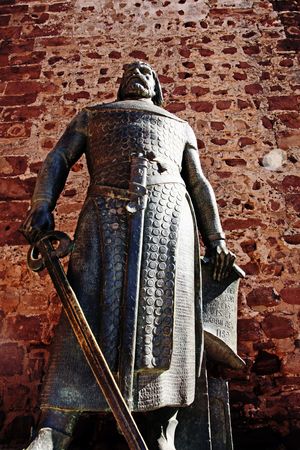 Low perspective angle view of the statue of portuguese king D.Sancho I located at the entrance of the castle of Silves, Portugal.の写真素材