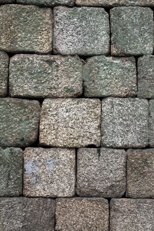 Close view of an old castle textured stone wall.の写真素材