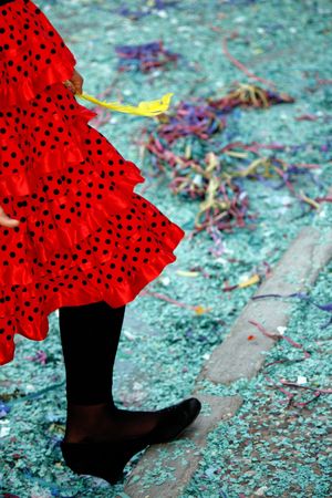 View of the foot and a red with black spots dress on the carnival festivities.の写真素材