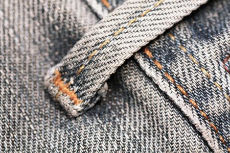 Macro view of the detail of some blue jeans.