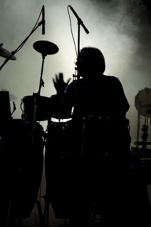 View of a percussion performer silhouette on a concert.