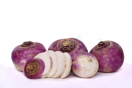 Detail view of a bunch of purple turnips isolated on a white background.の写真素材