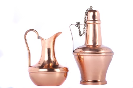 View of two old water recipients made of copper isolated on a white background.の写真素材