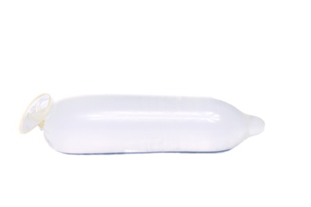 Close view of a condom isolated on a white background.の写真素材