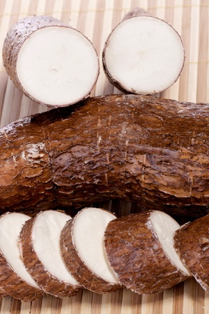 Close up view of the cassava root isolated on a white background.の写真素材