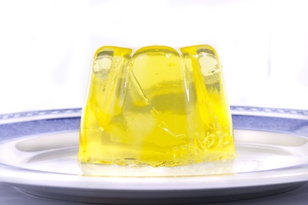 Close up view of  a yellow gelatin isolated on a white background.の写真素材