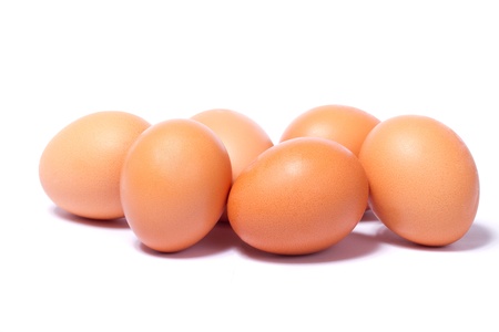 Close view of some eggs  isolated on a white background.