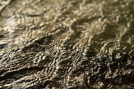 Close view of fast flowing fresh water on a river.の写真素材