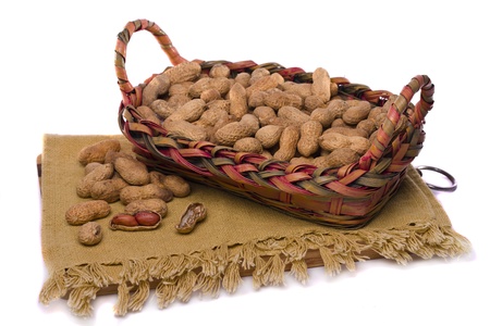 Close view detail of a bunch of peanuts on a white background.の写真素材