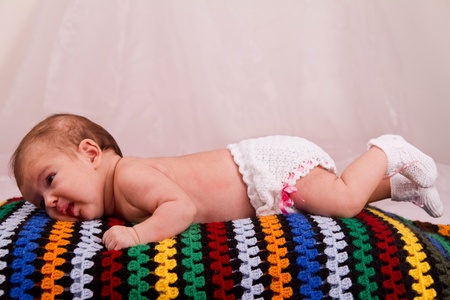 View of a newborn baby on a smooth bed.の写真素材