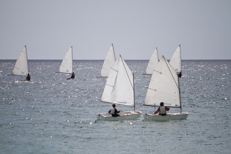 View of several beautiful sail boats on the ocean.の写真素材