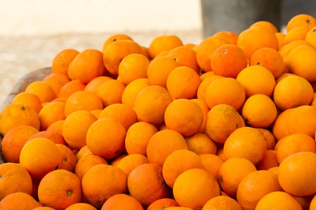 Close view of a pile of many oranges. の写真素材
