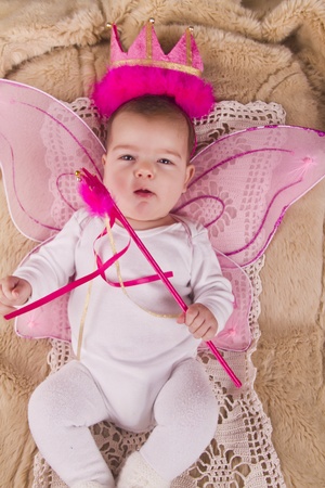 View of a newborn baby with princess hat の写真素材