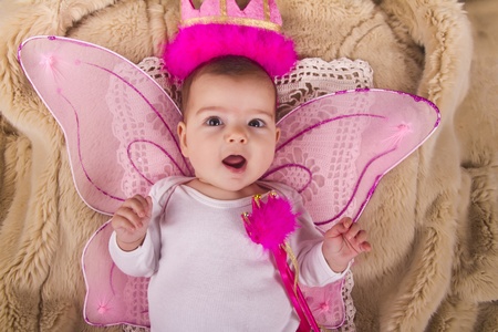 View of a newborn baby with princess hat の写真素材