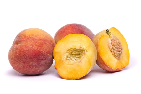 Close view of some tasty peaches isolated on a white background.の写真素材