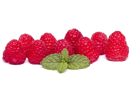 View of several tasty raspberries isolated on a white background.
