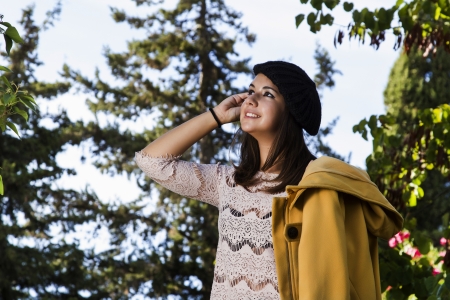 View of a beautiful girl in a autumn seasonal setting.の写真素材