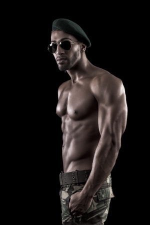 View of a muscled man on a black background in artistic, fitness and bodybuilding poses.の写真素材