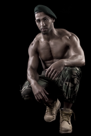 View of a muscled man on a black background in artistic, fitness and bodybuilding poses.の写真素材