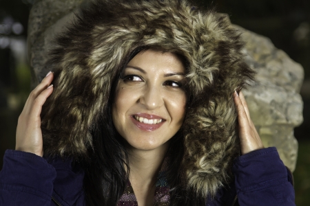 Young beautiful woman with big hairy winter jacket.の写真素材