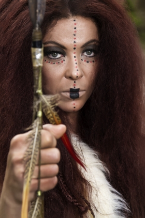 View of a beautiful young strong hunter warrior woman.の写真素材