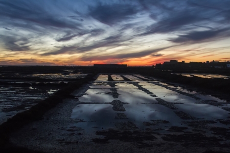 View of a industrial saline location in the sunset.の写真素材