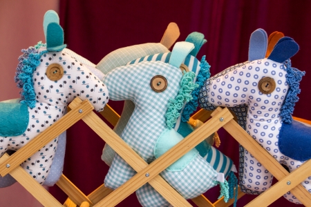 Close up view of a cute and traditional handmade doll horses.の写真素材