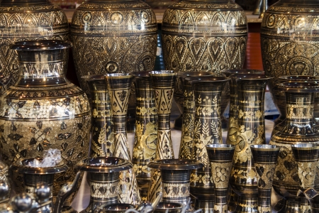 Close up view of a beautiful display of luxury Moroccan golden pottery.の写真素材
