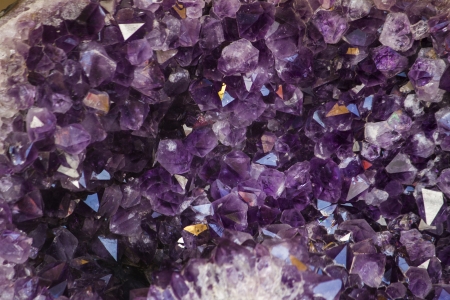 Close up view of a natural violet amethyst crystal geode stone.の写真素材
