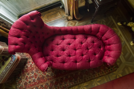 View of a beautiful red classical sofa located on Palace of Pena, located in Sintra, Portugal.のeditorial素材
