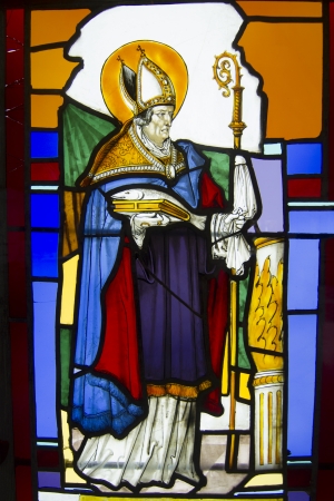 Close view of beautiful stained glass paintings depicting religious Christian scenes.のeditorial素材