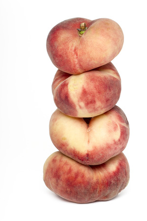 Close up view of a pile of tasty paraguayo peaches isolated on a white background.の写真素材
